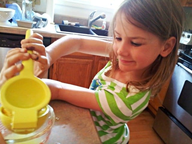 Little Miss squeezing lemons for homemade lemonade